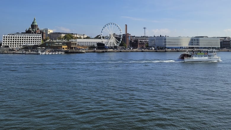At Helsinki's Market Square, there's a Ferris wheel, a cruise ship, and Allas Sea Pool.
